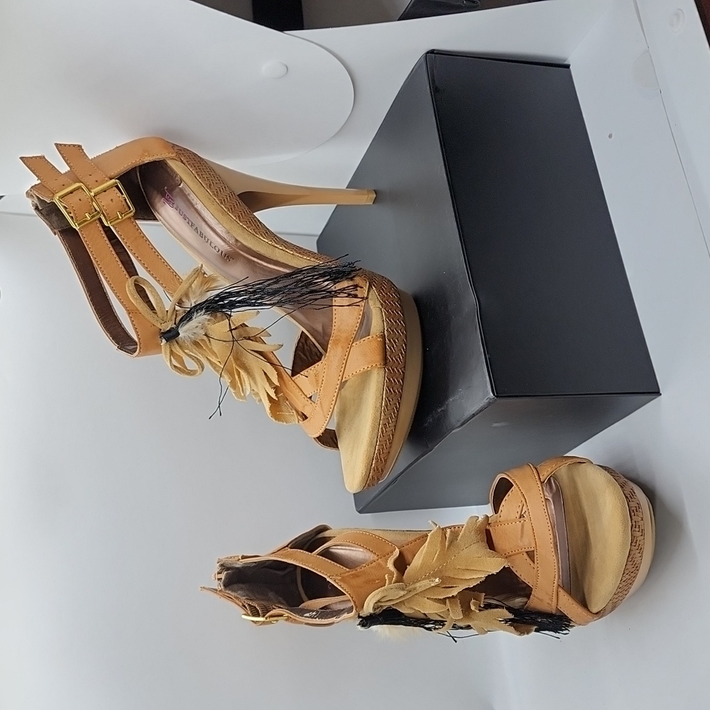 I'm selling a pair of Just Fabulous leather strapped heels. Size 9.